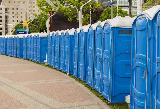 a row of portable restrooms at a fairground, offering visitors a clean and hassle-free experience in antonia